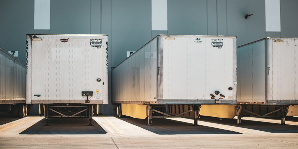 Refrigerated truck and passive cold-chain containers illustrating Vietnam's cold-chain infrastructure gap.